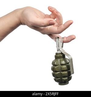 Woman`s hand holds on finger the old green shrapnel Hand Grenade Weapon of War, Isolated White Stock Photo
